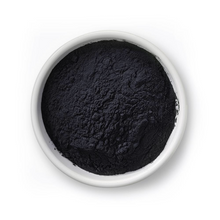 Bowl of Selenium powder against a white background
